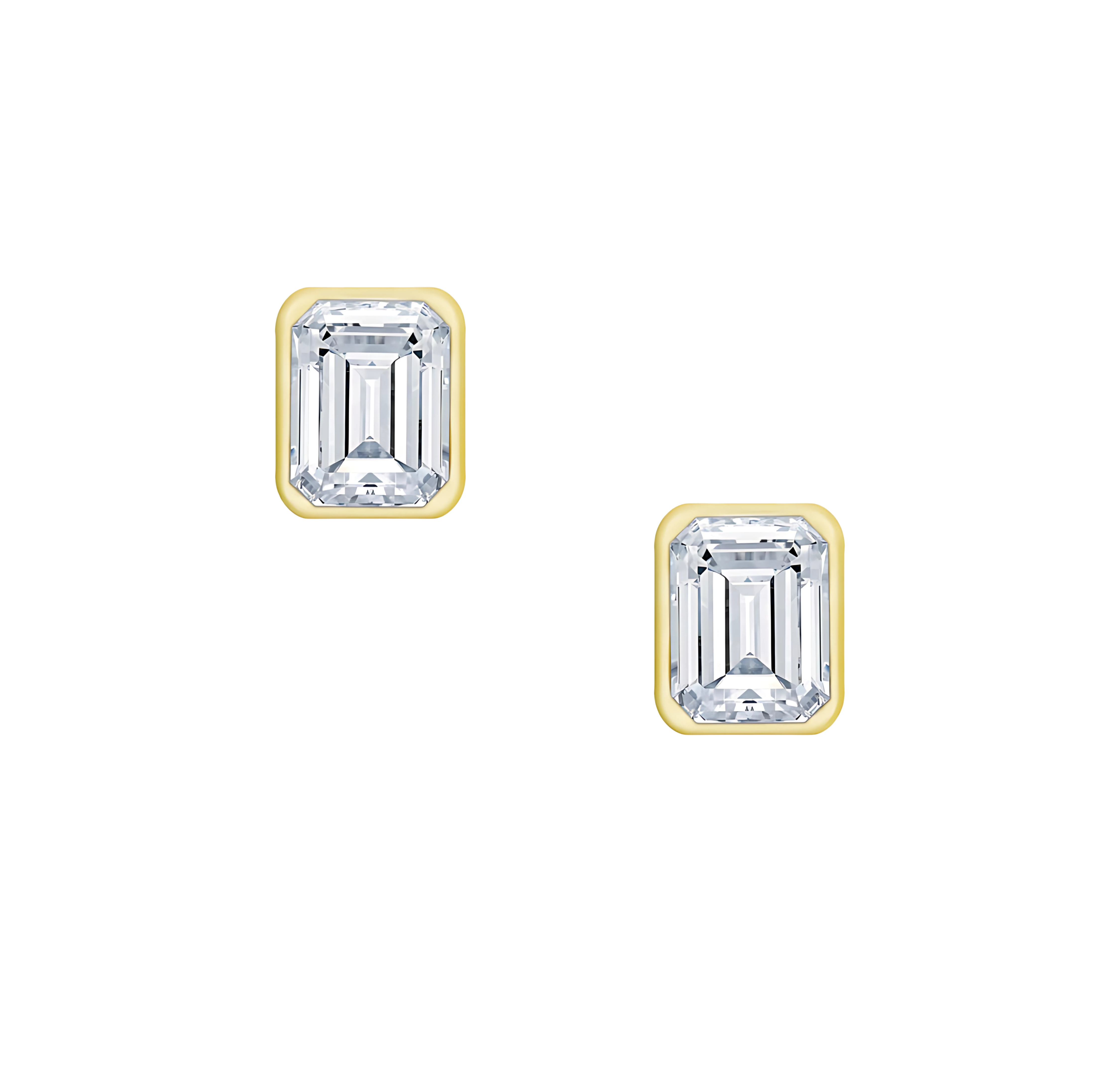 18 Karat .55ct Emerald Cut Bezel Set Stud Earrings